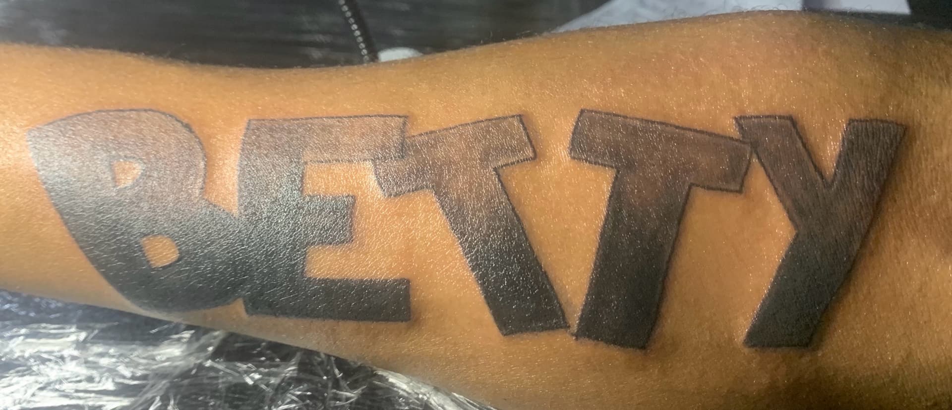 Lettering + Black-work betty tattoo on Forearm by Kaapt3ntattoos on TattMe