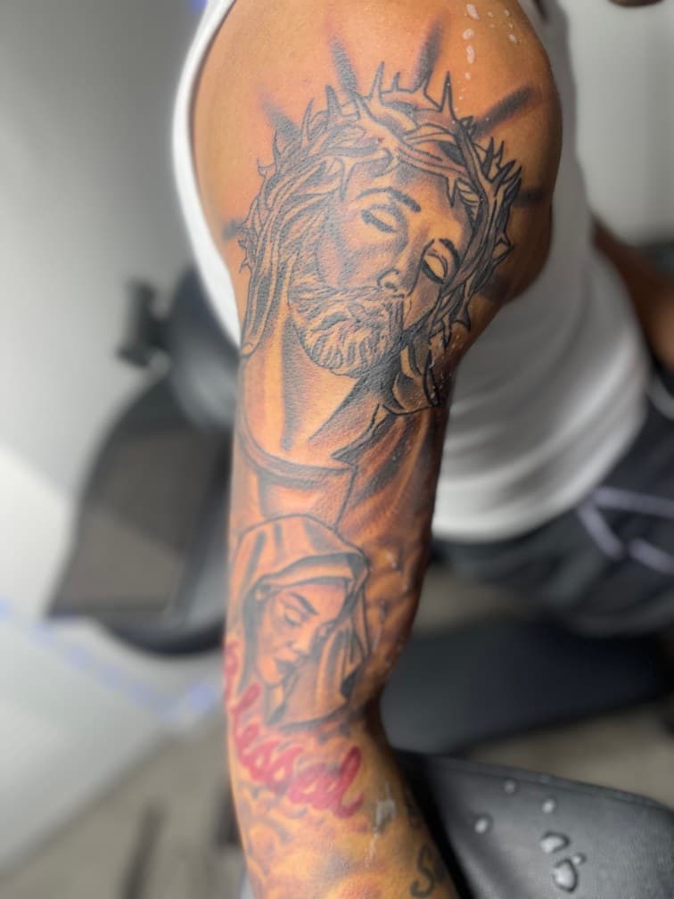 Black & Grey + Realism jesus tattoo on Upper Arm by LV on TattMe