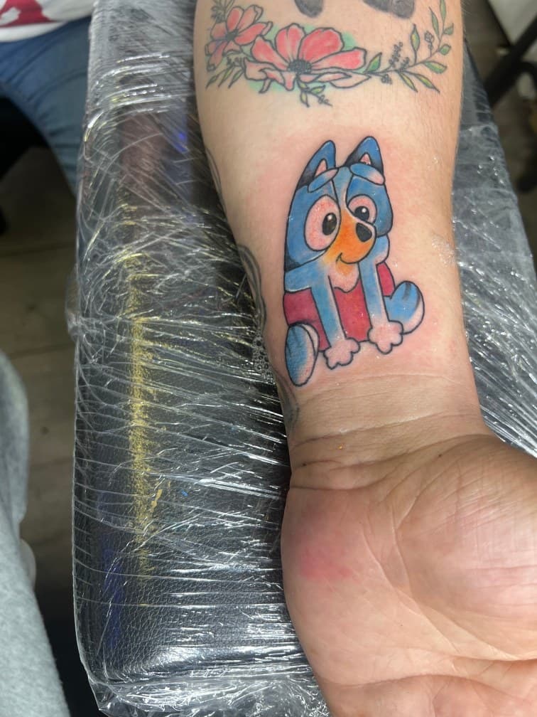 Color + Cartoon dog tattoo on Forearm by LV on TattMe