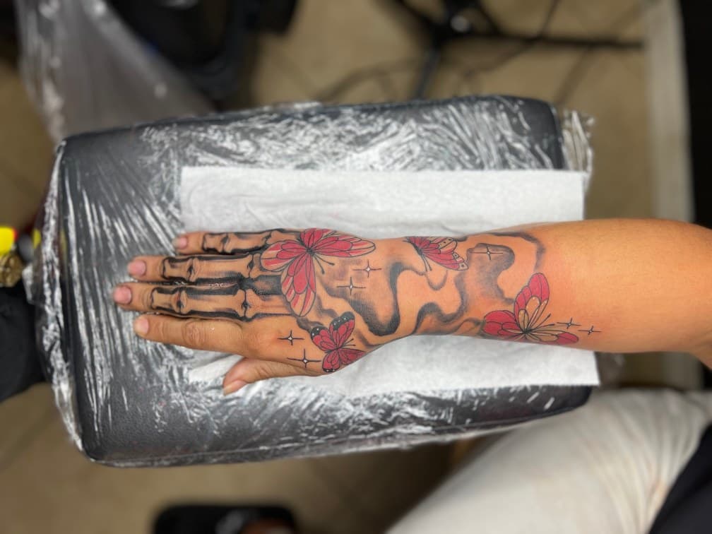Black & Grey + Color skeleton tattoo on Hand by LV on TattMe