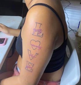 Lettering + Script love tattoo on Upper Arm by LV on TattMe
