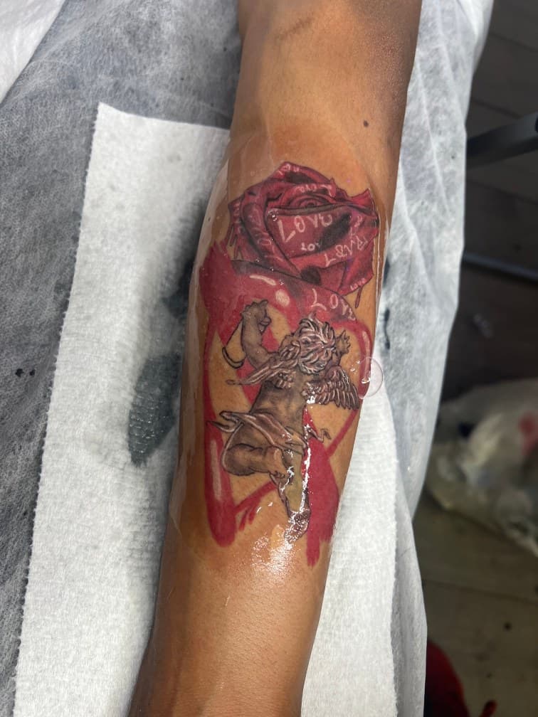Color + Black & Grey cherub tattoo on Forearm by LV on TattMe