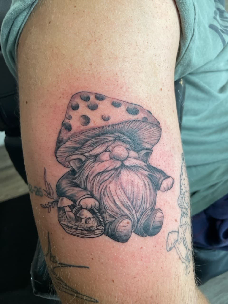 Black & Grey + Illustrative gnome tattoo on Upper Arm by all_saints_social on TattMe
