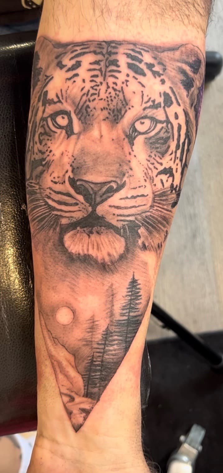 Black & Grey + Realism leopard tattoo on Forearm by all_saints_social on TattMe
