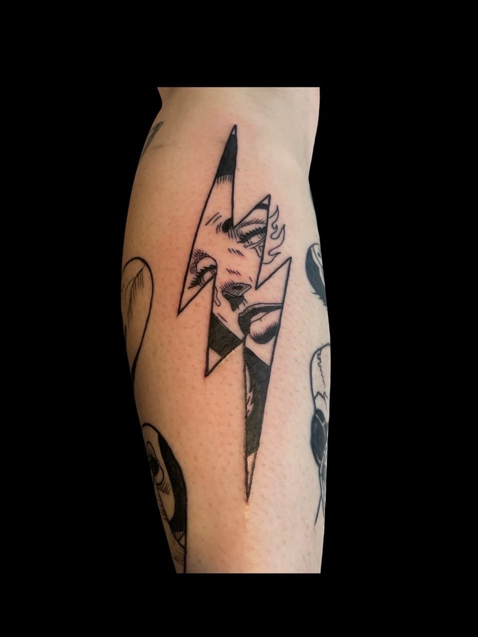 Black-work + Illustrative lightning bolt tattoo on Calf by all_saints_social on TattMe