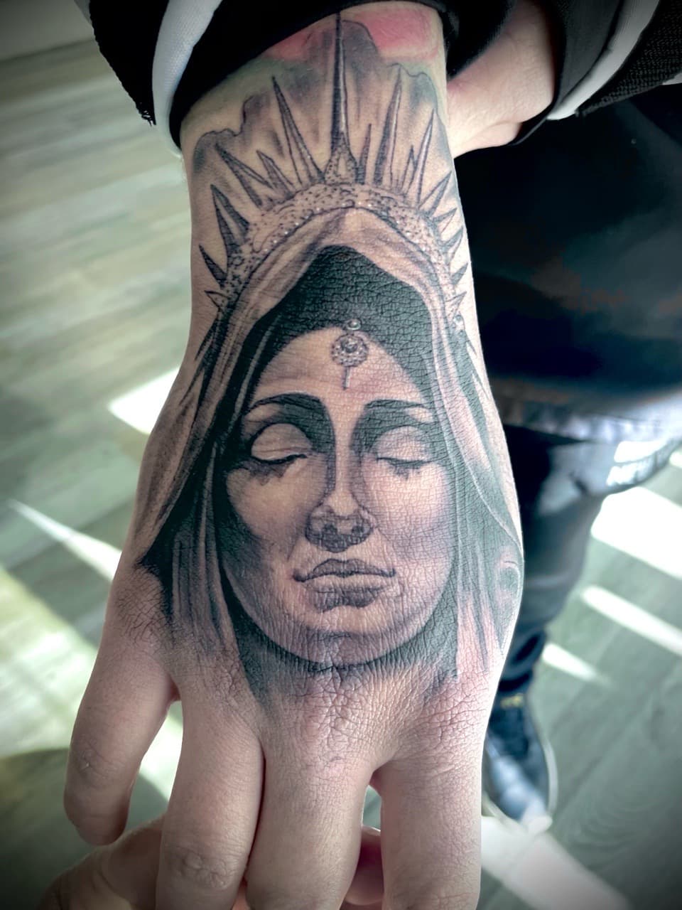 Black & Grey + Portrait woman tattoo on Hand by all_saints_social on TattMe
