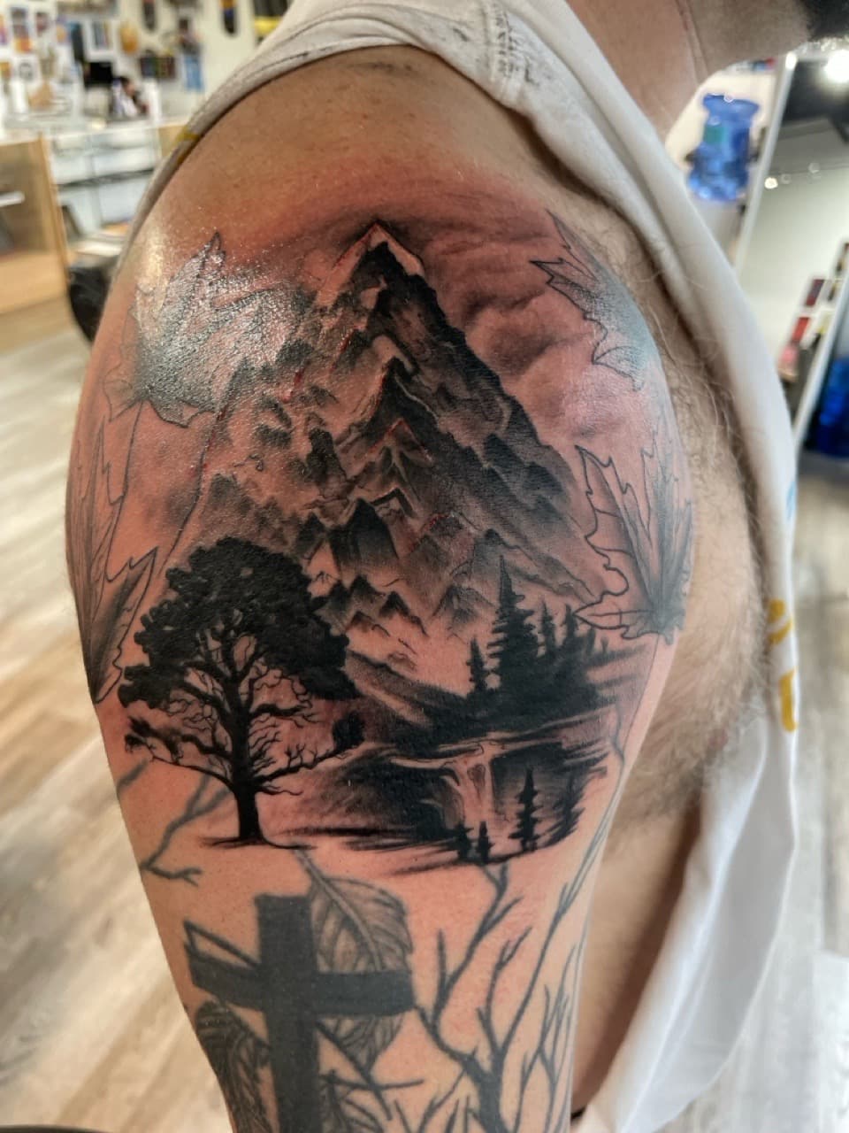 Black & Grey + Illustrative mountains tattoo on Upper Arm by all_saints_social on TattMe