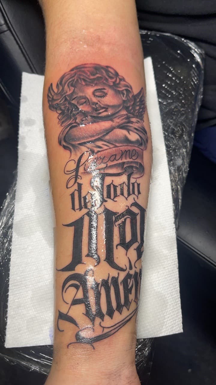 Black & Grey + Lettering angel tattoo on Forearm by MauryTatz on TattMe