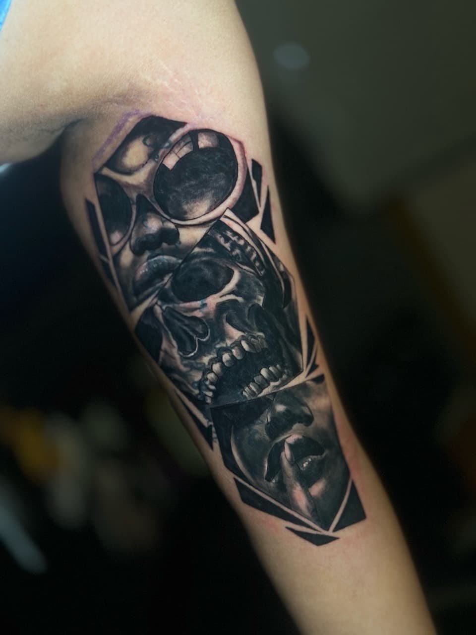 Black & Grey + Illustrative Realism faces tattoo on Upper Arm by J.R._Outlaw on TattMe