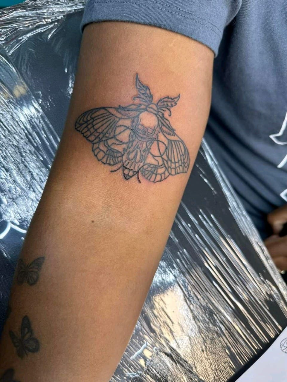 Fine Line + Black-work moth tattoo on Upper Arm by mimsey_ink on TattMe