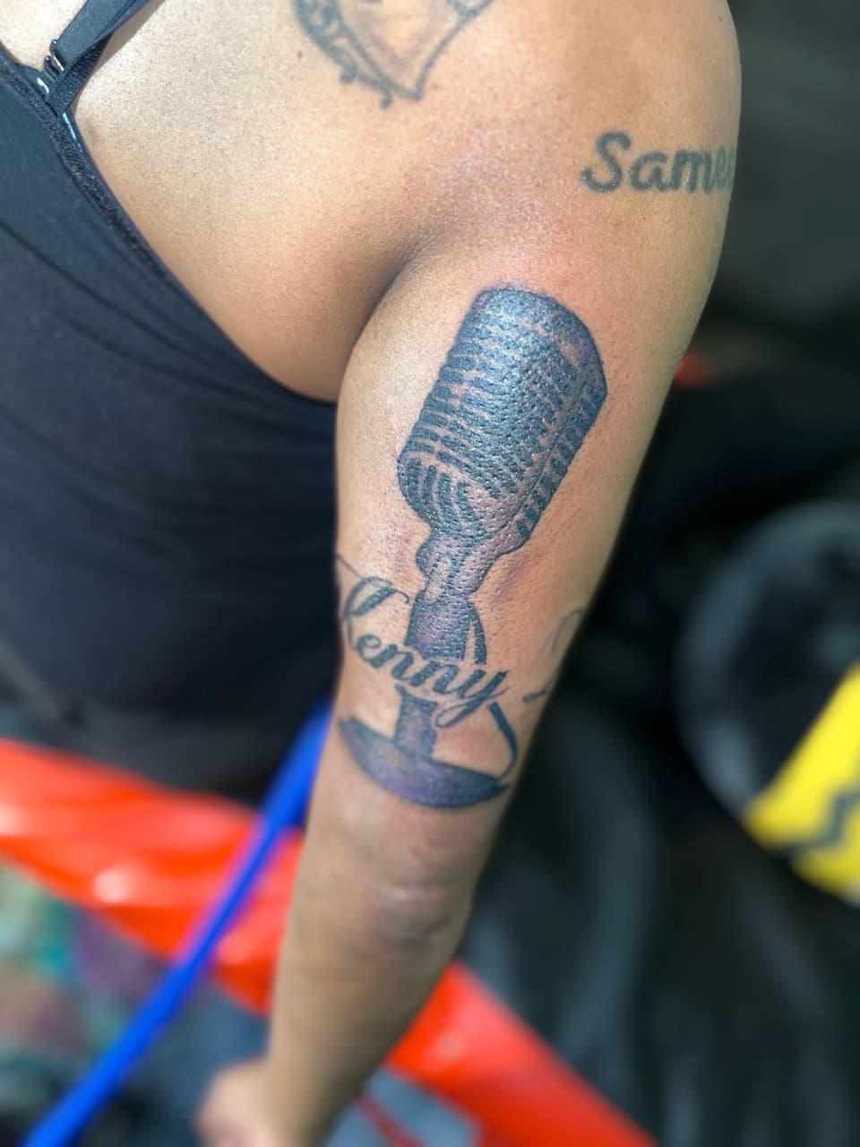 Black & Grey + Script microphone tattoo on Upper Arm by staylitink on TattMe