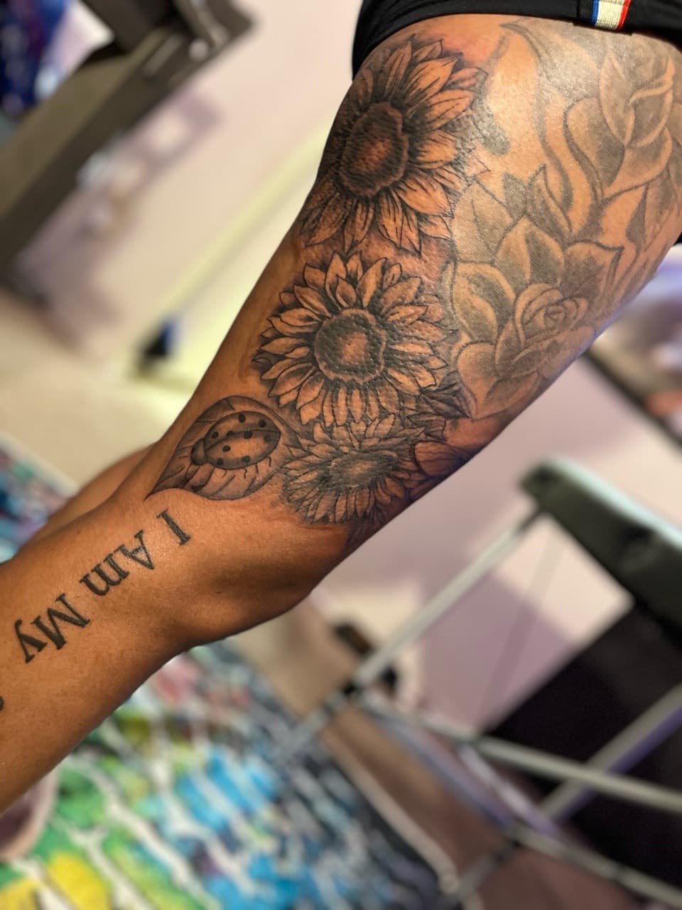 Black & Grey + Floral sunflowers tattoo on Upper Arm by staylitink on TattMe