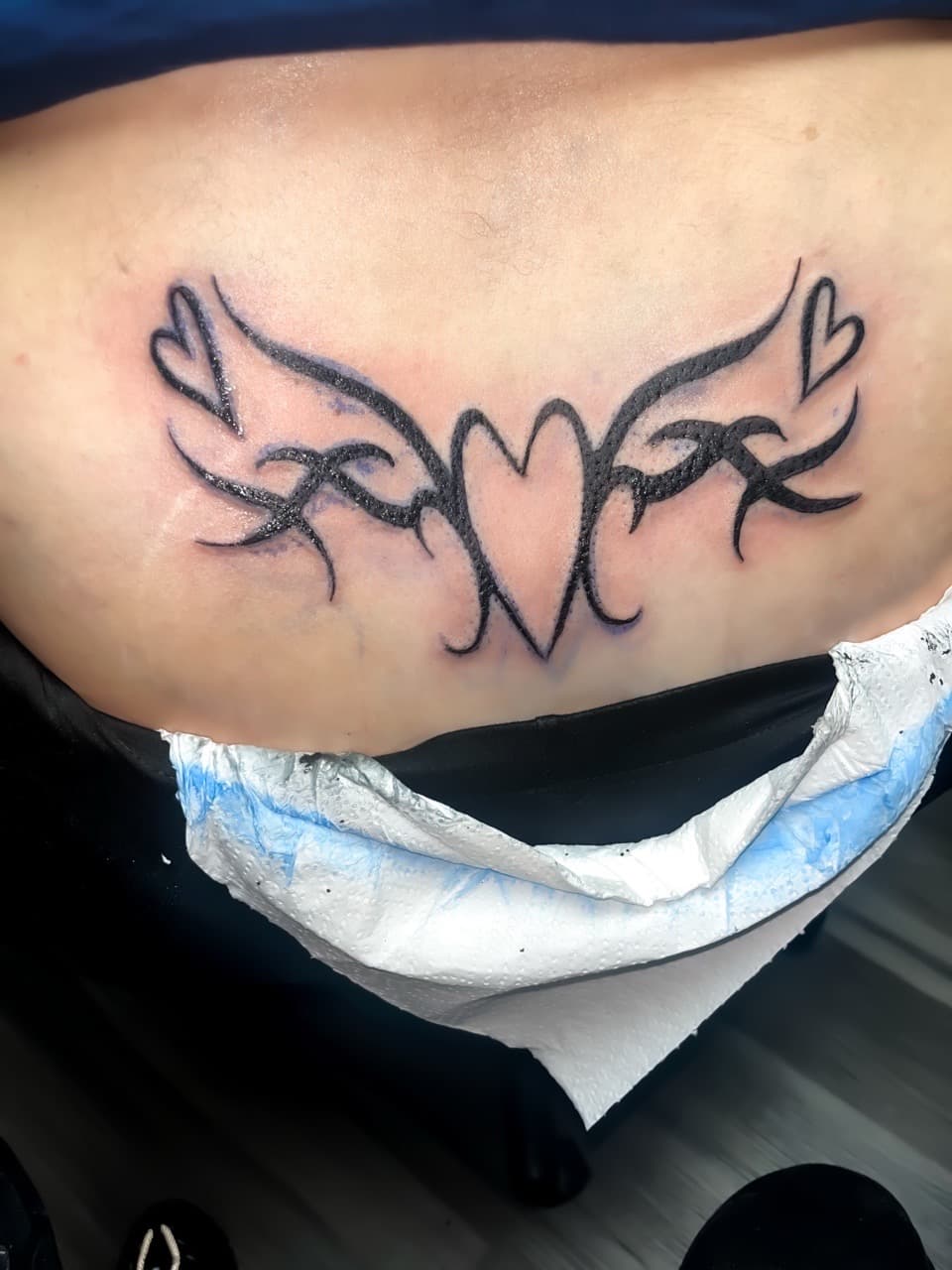 Black-work + Tribal hearts tattoo on Lower Back by staylitink on TattMe