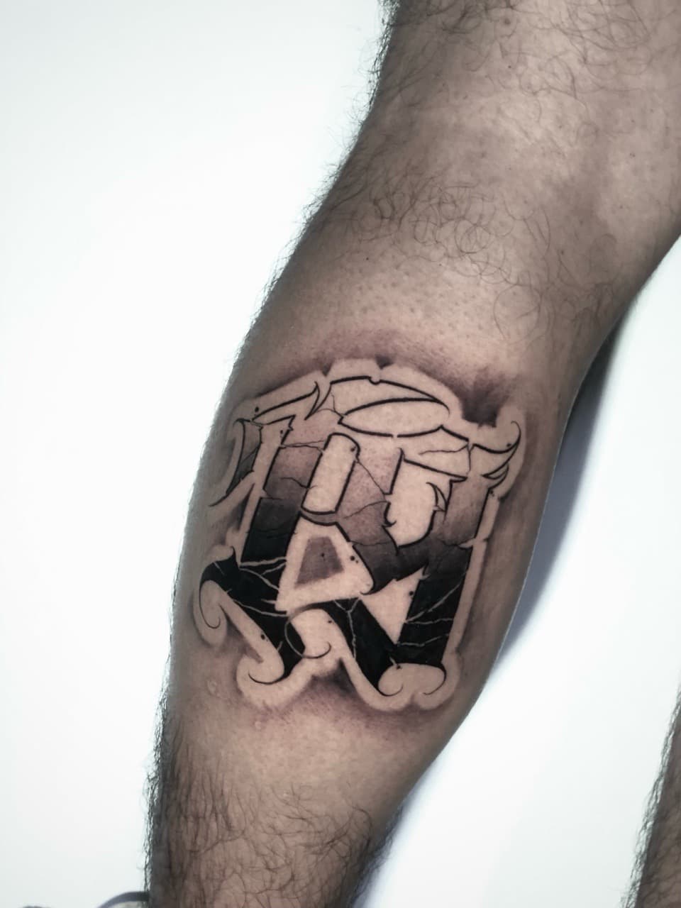 Black & Grey + Lettering cracked tattoo on Calf by Cael_Tattoos on TattMe