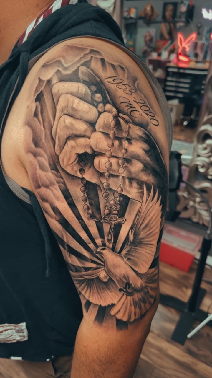 Black & Grey + Realism hands tattoo on Upper Arm by Cael_Tattoos on TattMe