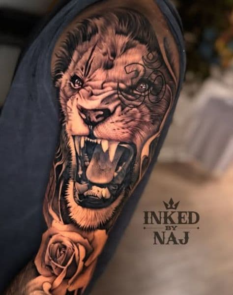 Black & Grey + Realism lion tattoo on Upper Arm by InkedByNaj on TattMe