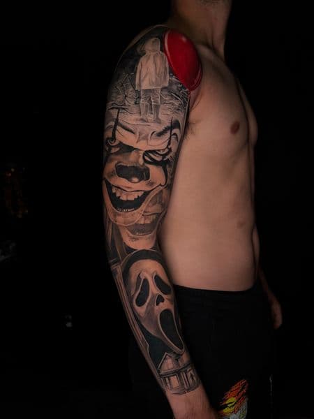 Realism + Black & Grey Pennywise tattoo on Full Sleeve by Official_Ceda_Ink_ on TattMe