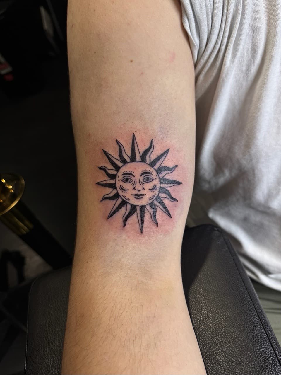 Black-work + Illustrative sun tattoo on Upper Arm by xRay_The_Artist on TattMe