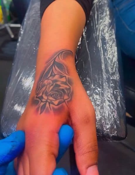 Black & Grey + Illustrative rose tattoo on Hand by Capital_City_Art_Loft on TattMe