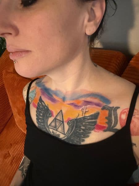 Watercolor + Black-work triforce tattoo on Chest by Siren_Tattoo on TattMe