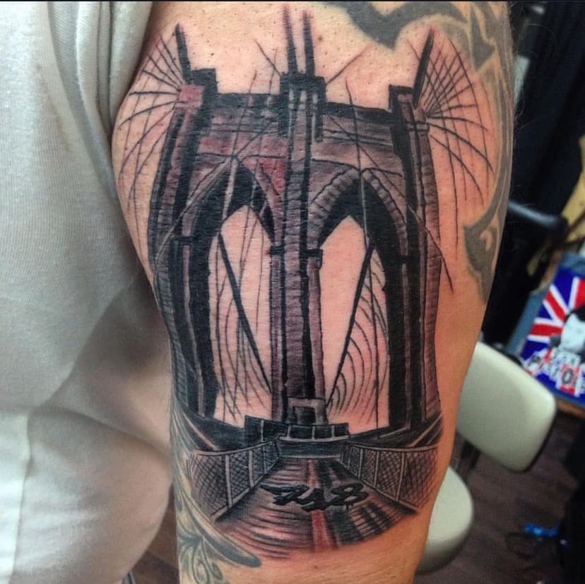 Black & Grey + Illustrative bridge tattoo on Upper Arm by A1_gallery on TattMe