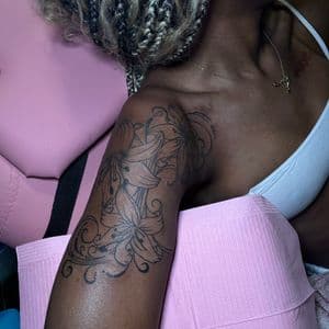 Fine Line flowers tattoo on Upper Arm by InkedByNaireea on TattMe