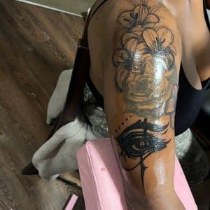 Traditional flowers tattoo on Upper Arm by InkedByNaireea on TattMe