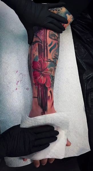 Floral + Color hibiscus tattoo on Shin by NebsiOne on TattMe