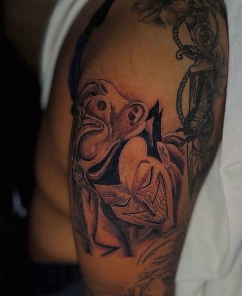 Black & Grey + Illustrative masks tattoo on Upper Arm by Callme_Lroy on TattMe