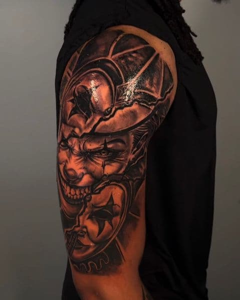 Black & Grey + Realism clown tattoo on Upper Arm by Tattedbyd on TattMe