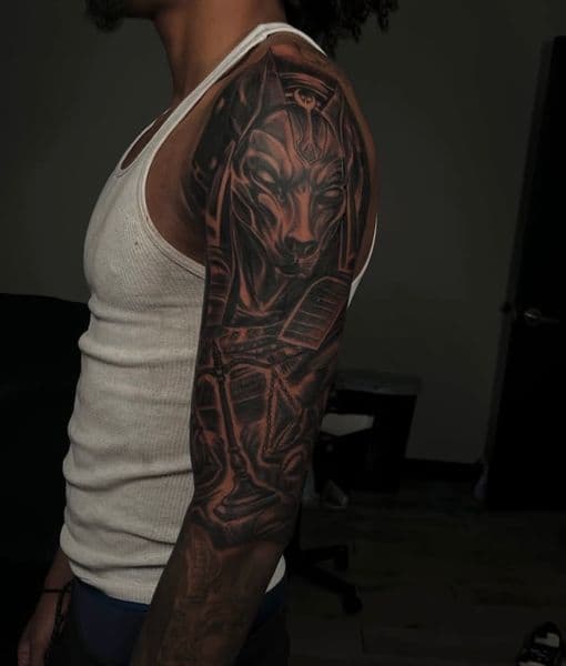 Black & Grey + Illustrative Realism anubis tattoo on Full Sleeve by Tattedbyd on TattMe