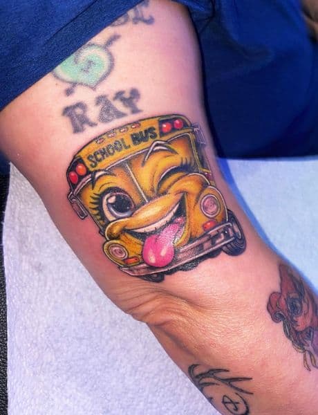 Cartoon + Color school bus tattoo on Upper Arm by Visionaryinkstudios on TattMe