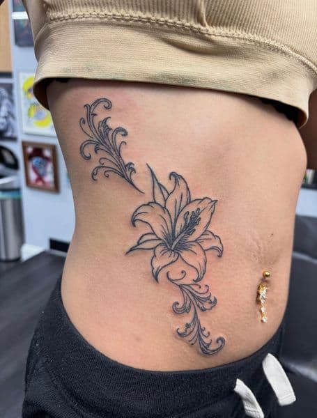 Fine Line + Floral lily tattoo on Ribs by Ben_Whit on TattMe