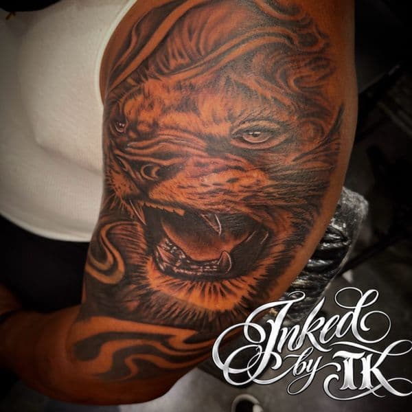 Black & Grey + Realism lion tattoo on Upper Arm by Inked_By_Tk on TattMe