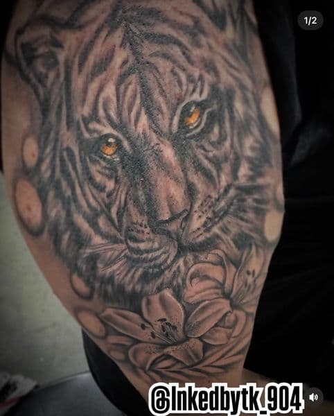 Black & Grey + Realism tiger tattoo on Upper Arm by Inked_By_Tk on TattMe