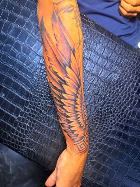 Illustrative + Black-work wings tattoo on Forearm by Inked_By_Tk on TattMe