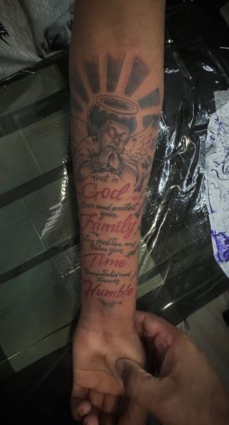 Black & Grey + Lettering cherub tattoo on Forearm by Lavan_Wright on TattMe