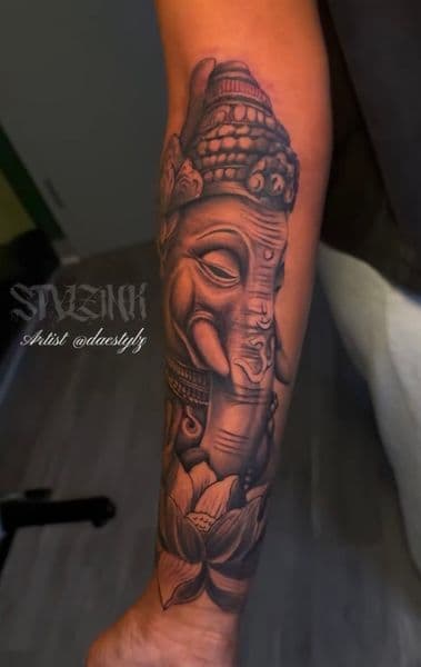 Black & Grey + Illustrative Ganesha tattoo on Forearm by STYLZINK on TattMe