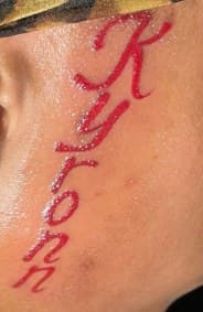 Lettering + Script name tattoo on Face by Sweeettendenciestatts on TattMe