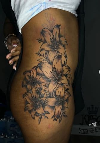 Floral + Black & Grey lilies tattoo on Side (Torso) by Armarta_Gibbs on TattMe