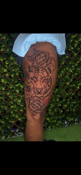 Black & Grey + Illustrative tiger tattoo on Thigh by splattedby_BG on TattMe