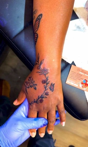 Fine Line + Floral flowers tattoo on Hand by DaBreon_Woods on TattMe