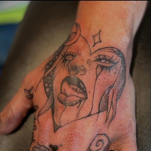 Illustrative + Black-work face tattoo on Hand by Maya_Johnson on TattMe