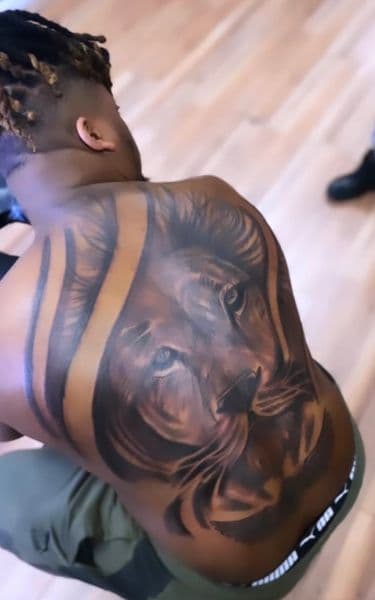 Realism + Black & Grey lion tattoo on Upper Back by Rell on TattMe