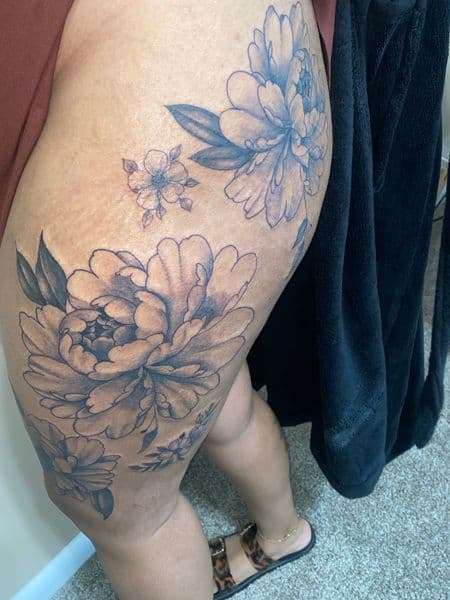 Floral + Illustrative flowers tattoo on Thigh by Trill.Tattoos on TattMe
