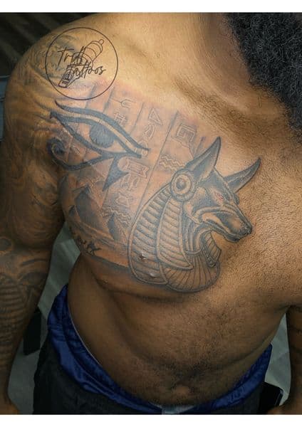 Black & Grey + Illustrative anubis tattoo on Chest by Trill.Tattoos on TattMe