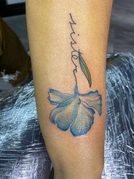 Lettering + Script flower tattoo on Forearm by Trill.Tattoos on TattMe