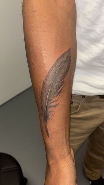 Black & Grey + Illustrative feather tattoo on Forearm by bitchie on TattMe