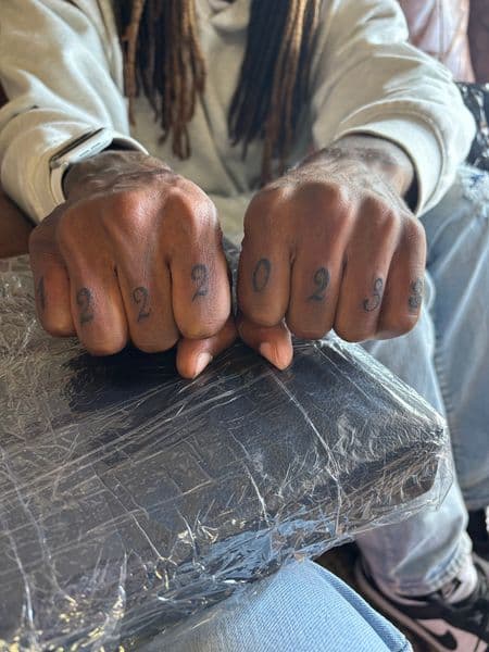 Lettering + Script numbers tattoo on Fingers by bitchie on TattMe