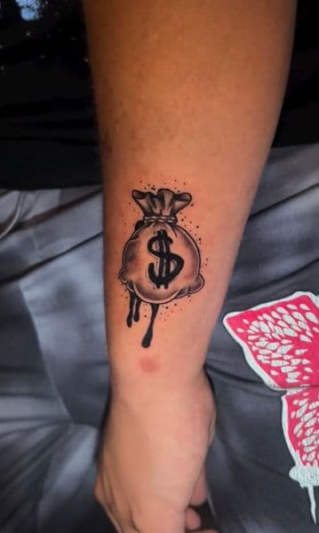 Black & Grey + Illustrative money bag tattoo on Forearm by Nigel_Uno on TattMe